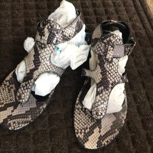 Snakeskin print sandals.